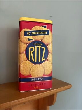 Christie Ritz 60th Anniversary Biscuit Tin - Red & Yellow